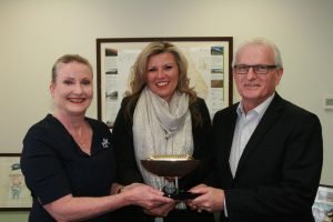 Samantha Edmunds of AREEA (centre) presenting the AWRA award to Jenny McAuliffe (Manager, Human Resources) and John Fullerton (Chief Executive Officer and Managing Director) of ARTC.